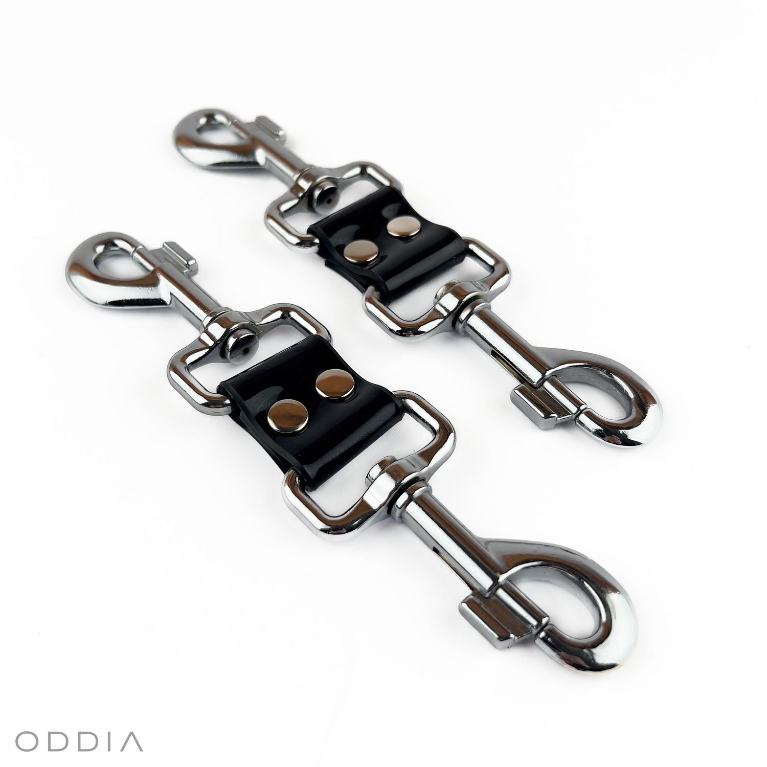 Black bondage connector for linking cuffs, ended with carabiners